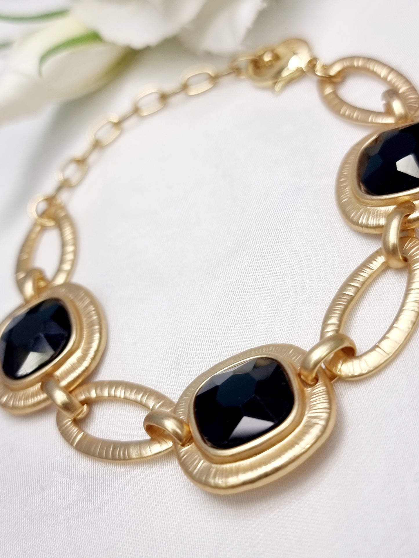 Glieder-Armband in Gold und schwarz BIBA