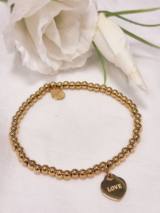 Armband mit goldenen Perlen und Love-Anhänger