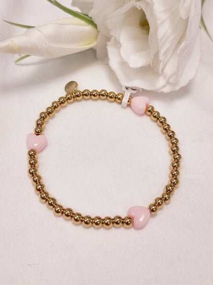 Edelstahl Armband gold mit kleinen Herzen in Rosa und Pink