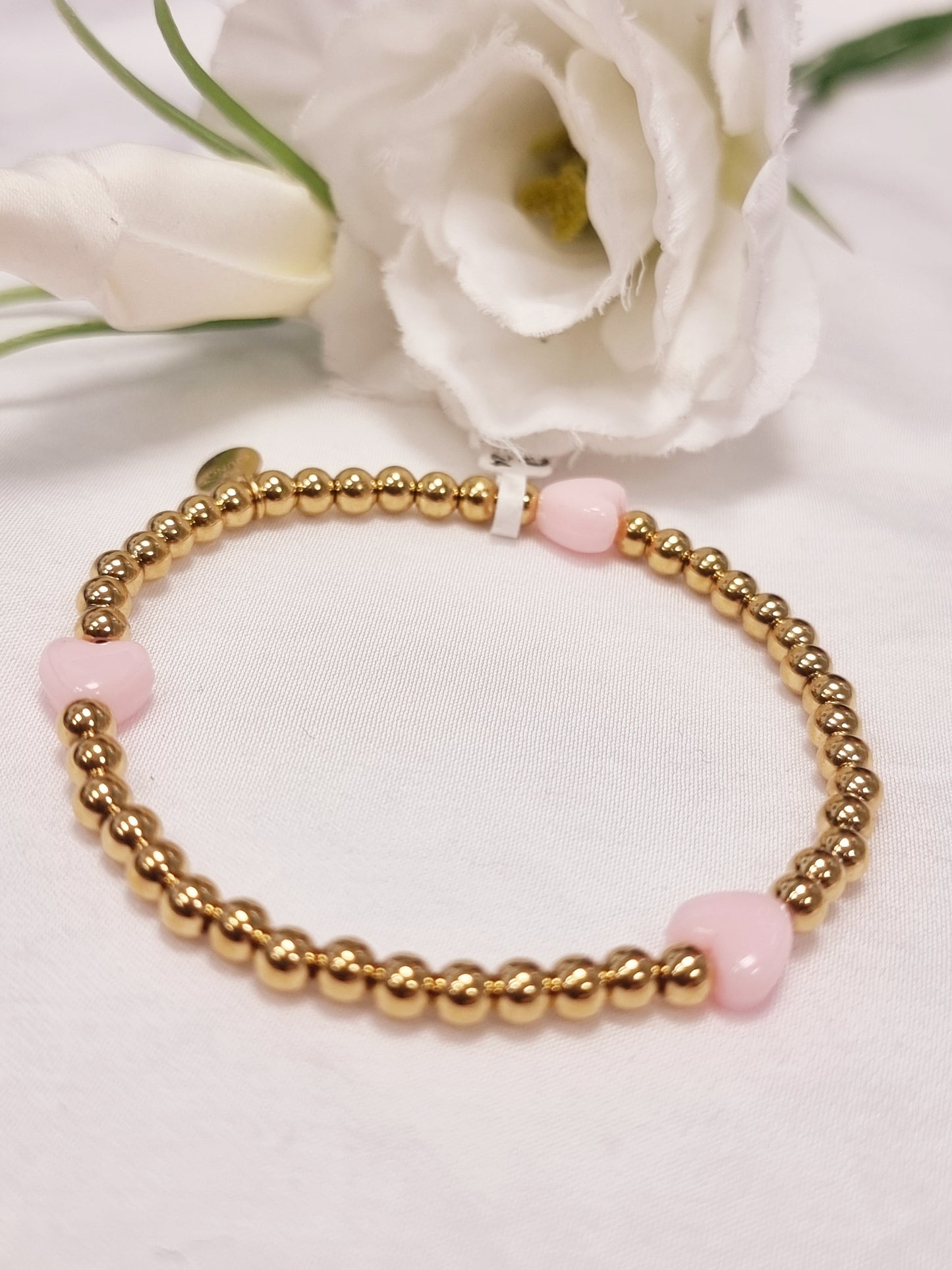 Edelstahl Armband gold mit kleinen Herzen in Rosa und Pink