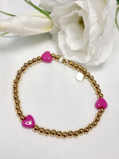 Edelstahl Armband gold mit kleinen Herzen in Rosa und Pink