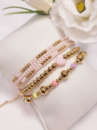 Edelstahl Armband gold mit kleinen Herzen in Rosa und Pink