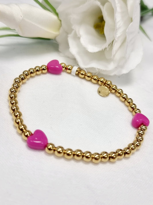 Edelstahl Armband gold mit kleinen Herzen in Rosa und Pink