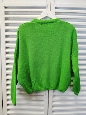 Kurze Strickjacke mit Knöpfen in verschiedenen Farben